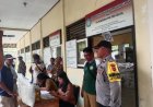 Babinsa dan Bhabinkamtibmas Dampingi Penyaluran Bantuan Pangan di Balai Desa Gelgel
